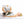 Person placing a HealthyLine gemstone heating mat on a woman lying on a massage table