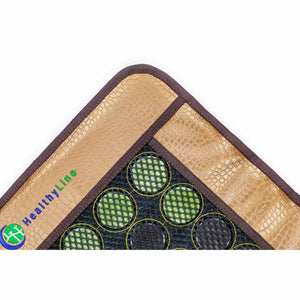 HealthyLine mat corner with textured tan border and embedded green circular discs