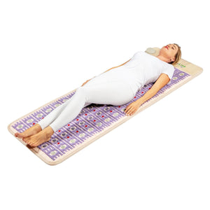 Person lying on a HealthyLine gemstone heating mat