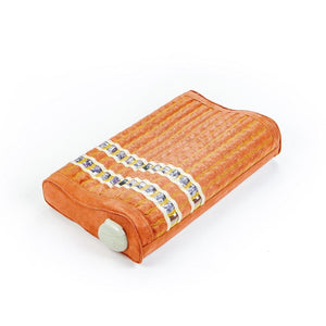 HealthyLine orange rectangular pillow with embedded amethyst stones and a control knob on the side