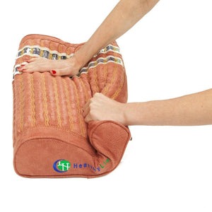 Hands pressing down on a HealthyLine textured bolster pillow
