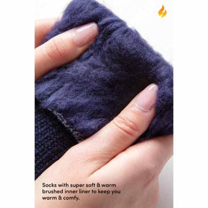 Close up of hands holding a Heat Holders sock showing the soft brushed inner lining