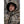 Man wearing a Heater Body Suit camouflage hooded jacket in a forest setting