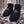 Black Heater Body Suit insulated boot covers on snowy forest ground