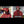 Heater Body Suit red and black plaid hooded garment demonstrating sealed hood and waterproof features