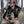 Hunter wearing Heater Body Suit camouflage gear holding deer antlers in a tree stand
