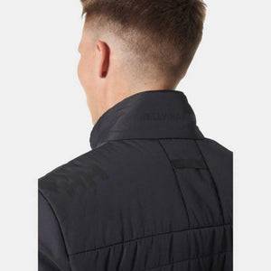 Back view of a person wearing a black Helly Hansen jacket with a high collar