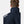 Back view of Helly Hansen navy jacket with HH logo on shoulder