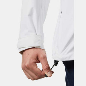 Hand adjusting the adjustable hem drawcord on a white Helly Hansen jacket