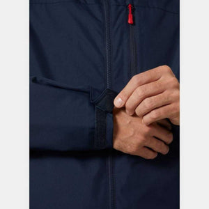 Close up of navy jacket sleeve with adjustable velcro cuff