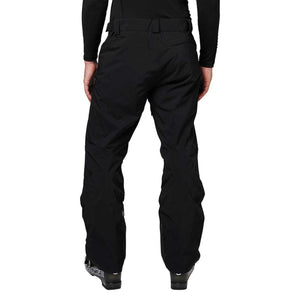 Back view of Helly Hansen black ski pants worn with ski boots