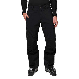 Helly Hansen black ski pants worn with ski boots