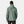 Back view of a person wearing a sage green Helly Hansen hooded rain jacket