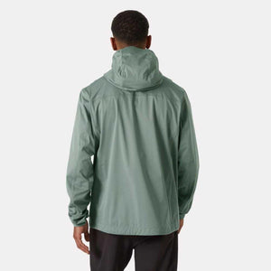 Back view of a person wearing a sage green Helly Hansen hooded rain jacket
