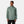 Man wearing a sage green Helly Hansen hooded rain jacket with HH logo