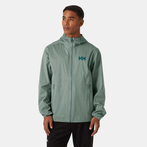 Man wearing a sage green Helly Hansen hooded rain jacket with HH logo