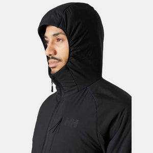 Man wearing a black Helly Hansen hooded jacket with HH logo