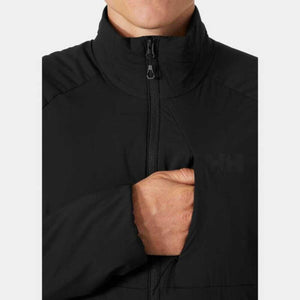 Close up of Helly Hansen black jacket with hand in chest pocket
