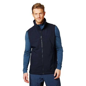 Man wearing a navy blue zip up softshell vest over a blue long sleeve shirt