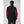 Back view of a person wearing a black Helly Hansen softshell vest over a red long sleeve shirt