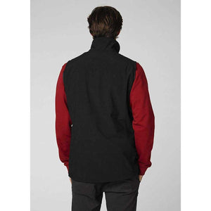 Back view of a person wearing a black Helly Hansen softshell vest over a red long sleeve shirt