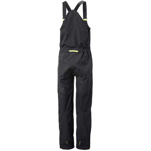 Back view of black Helly Hansen waterproof bib overalls with adjustable straps and yellow accents