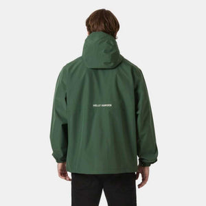 Back view of a person wearing a green Helly Hansen hooded rain jacket