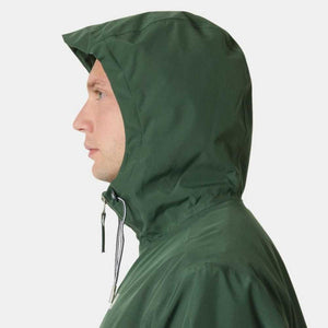 Profile view of a person wearing a dark green hooded jacket with a drawstring