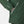 Close up of green Helly Hansen jacket sleeve and zippered pocket with Helly Tech Protection logo