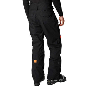 Back view of black Helly Hansen ski pants worn with ski boots