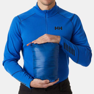 Person holding a blue Helly Hansen packable garment in a storage pouch