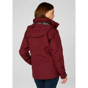 Back view of a woman wearing a burgundy Helly Hansen hooded rain jacket