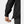 Close up of a hand adjusting the drawcord hem on a black jacket