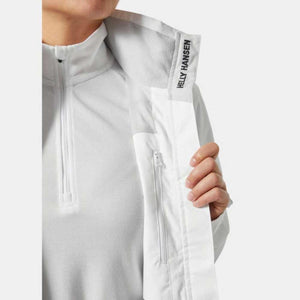 Close up of Helly Hansen white jacket interior with zipper pocket and branding on collar