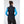 Back view of a woman wearing a black Helly Hansen vest over a blue long sleeve shirt