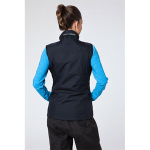 Back view of a woman wearing a black Helly Hansen vest over a blue long sleeve shirt