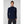 Woman wearing a navy Helly Hansen quarter zip fleece pullover