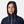 Person wearing a navy blue Helly Hansen hooded jacket with white drawstring cords