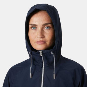 Person wearing a navy blue Helly Hansen hooded jacket with white drawstring cords
