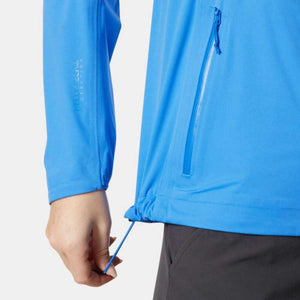 Close up of blue Helly Hansen jacket showing adjustable hem cord and Helly Tech branding on sleeve
