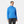 Woman wearing a blue Helly Hansen hooded rain jacket