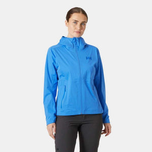 Woman wearing a blue Helly Hansen hooded rain jacket