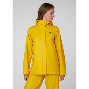 Woman wearing a yellow Helly Hansen hooded rain jacket
