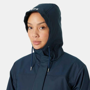Person wearing a navy Helly Hansen hooded rain jacket