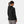 Back view of a woman wearing a black Helly Hansen hooded jacket