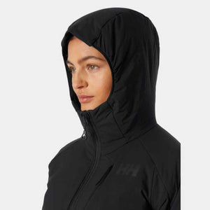 Person wearing a black Helly Hansen hooded jacket
