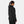 Woman wearing a black Helly Hansen hooded jacket viewed from the back