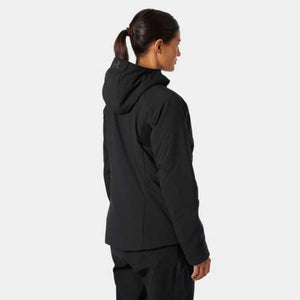 Woman wearing a black Helly Hansen hooded jacket viewed from the back