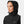 Woman wearing a black Helly Hansen hooded rain jacket