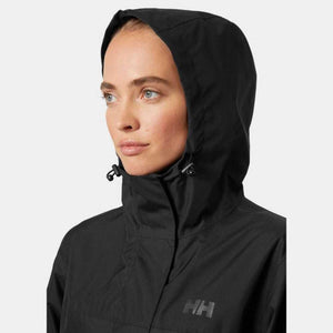 Woman wearing a black Helly Hansen hooded rain jacket